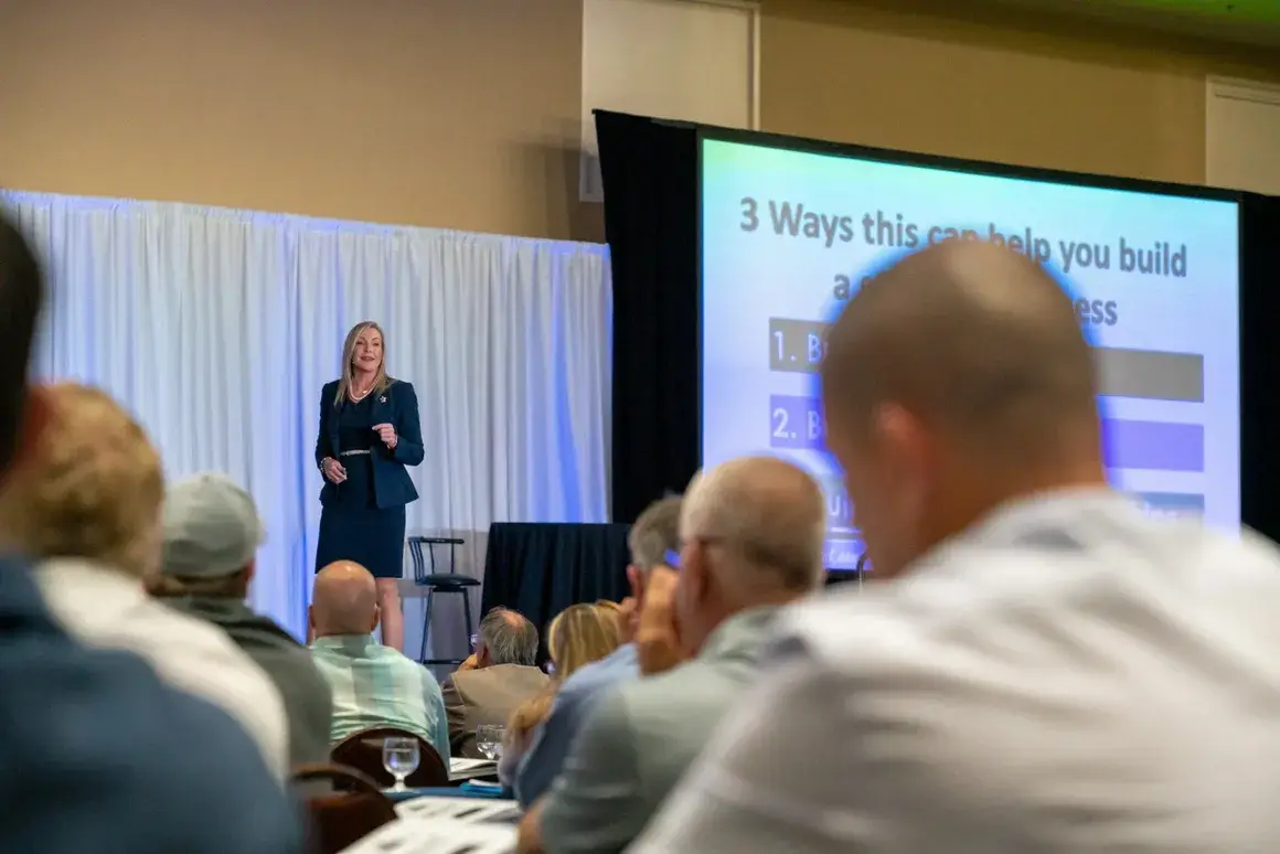 Krystal Parker delivering a keynote presentation to a business audience